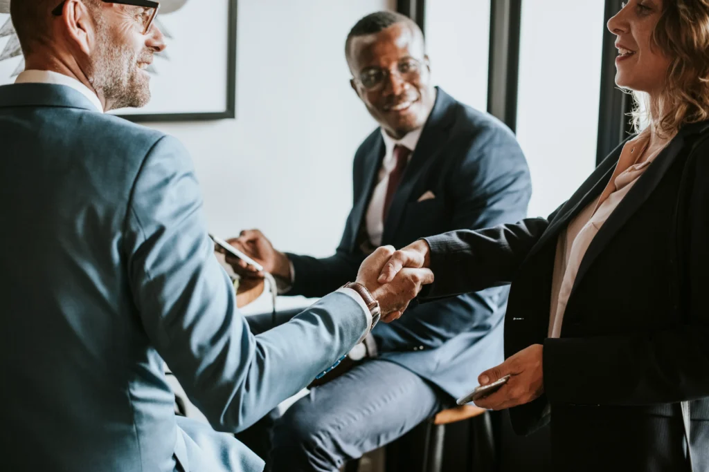 business-people-shaking-hands-in-a-cafe-2025-02-10-10-57-43-utc